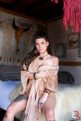 Young and busty brunette Indica Flower gets bare naked at a rural location