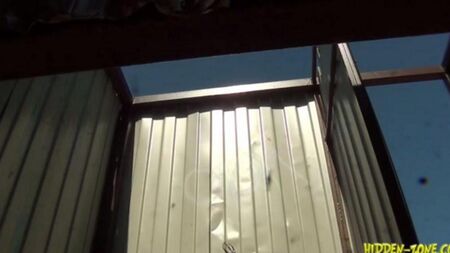 Hidden camera shoots a woman in a beach cabin