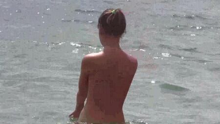 Naked nudists on the beach