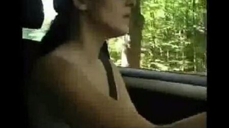 Naked woman driving a car