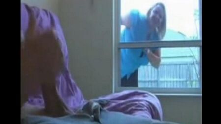 A woman peeps for a man sitting in a ward and jerking off a member