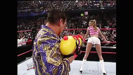 WWE - Stacy Keibler in white shorts sprayed by super soaker