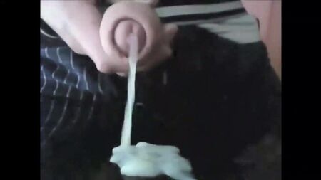 Young man spunking on cam from his uncut cock