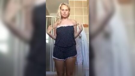 Big tits blonde stripping in her bathroom