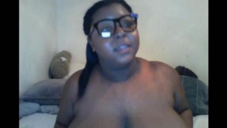 The black woman closed the camera with her big milking