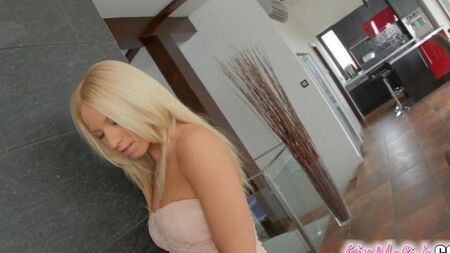 Beauty fucks herself with a rubber member