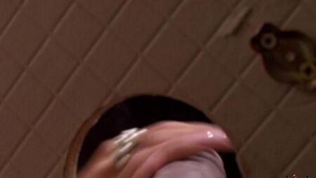 Beauty sucks a dick from a hole in the toilet
