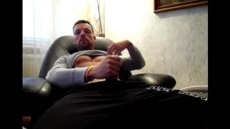 40-year-old sits in an armchair and taking out a member began to jerk off