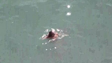 Naked pair at sea
