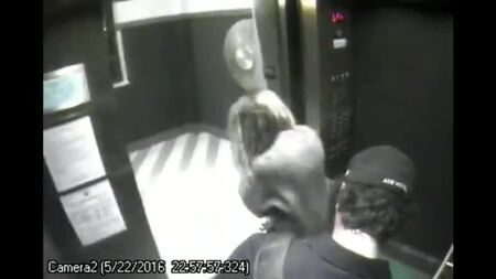 Amber Heard getting on the elevator with James Franco