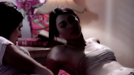 Two lesbians have fun with a strapon