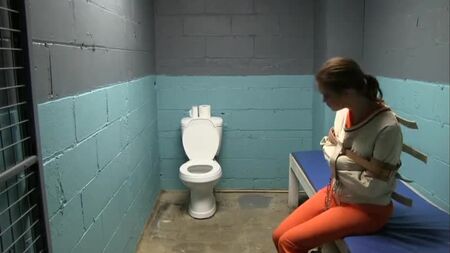 Straitjacket bondage in prison