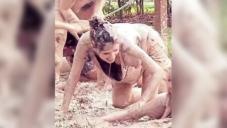 Anna Kendrick showing cleavage as she crawls in mud