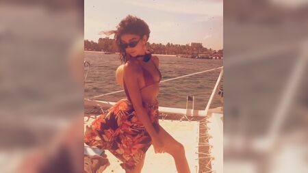 Sarah Hyland on a boat in a sexy bikini top